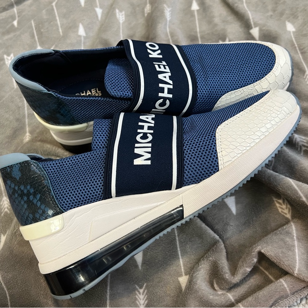 Michael Kors stretch slip on sneakers, with a slight heel pump. Like new